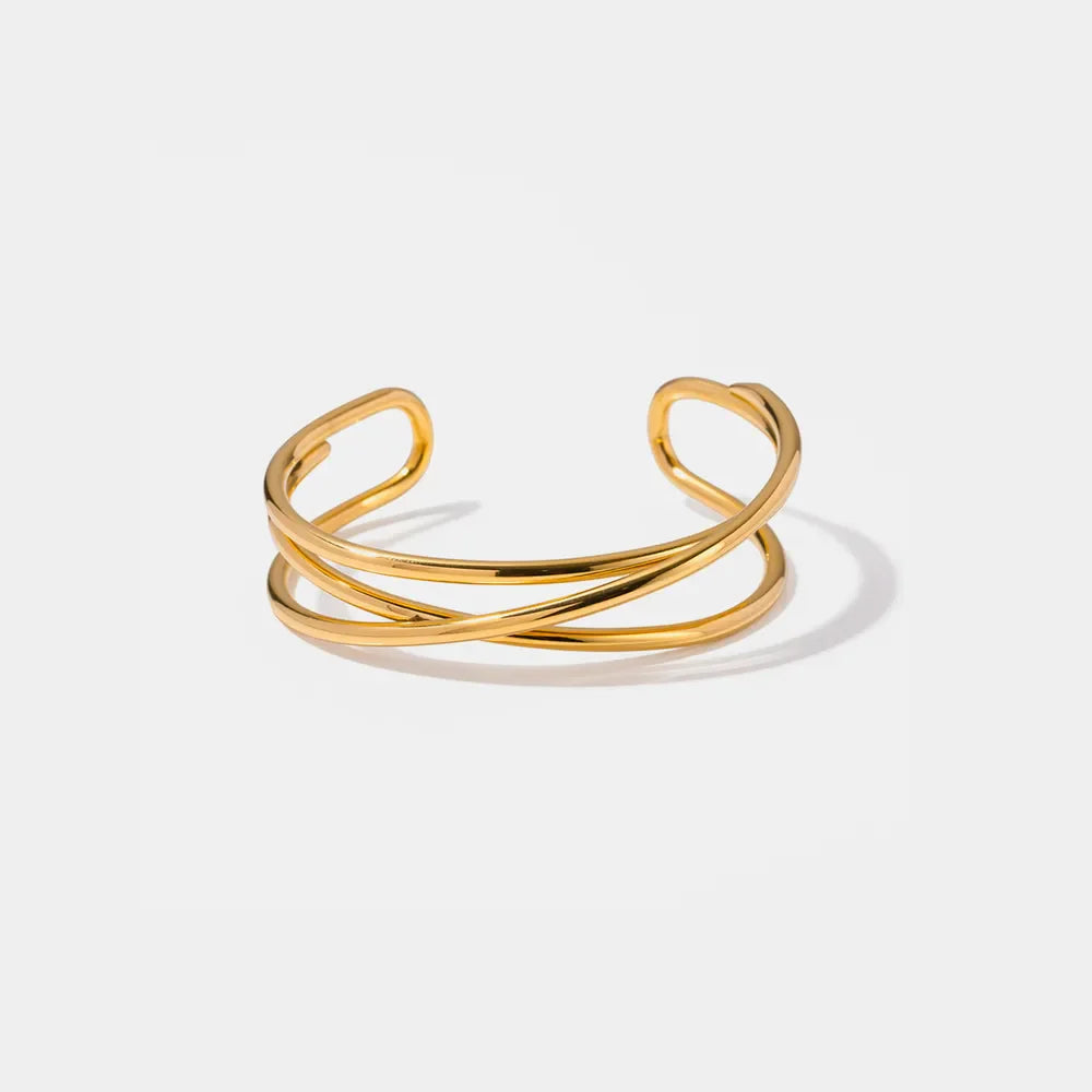 Gold-tone open cuff bracelet with intertwined design