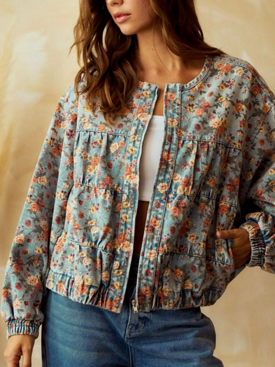 Cropped denim trucker jacket with floral print, round neck, and elasticated cuffs.