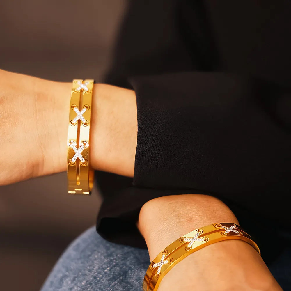 Gold cuff bracelet with diamond criss-cross detail