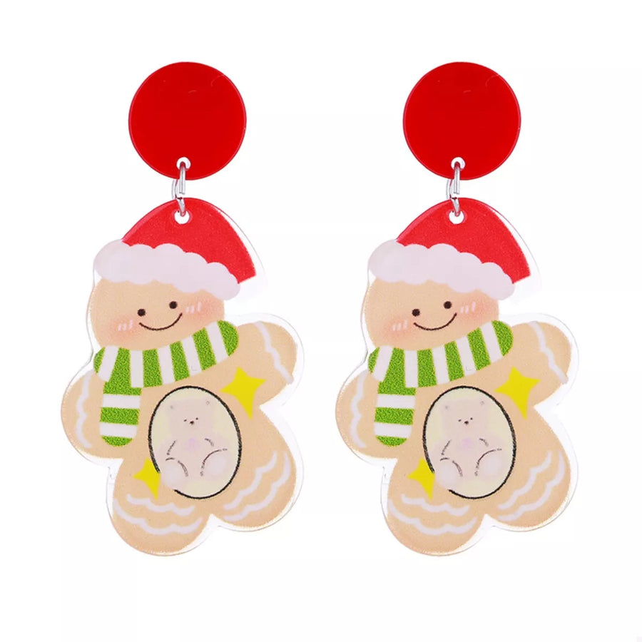 Festive Christmas gingerbread man dangle earrings with red tops and green striped scarves.