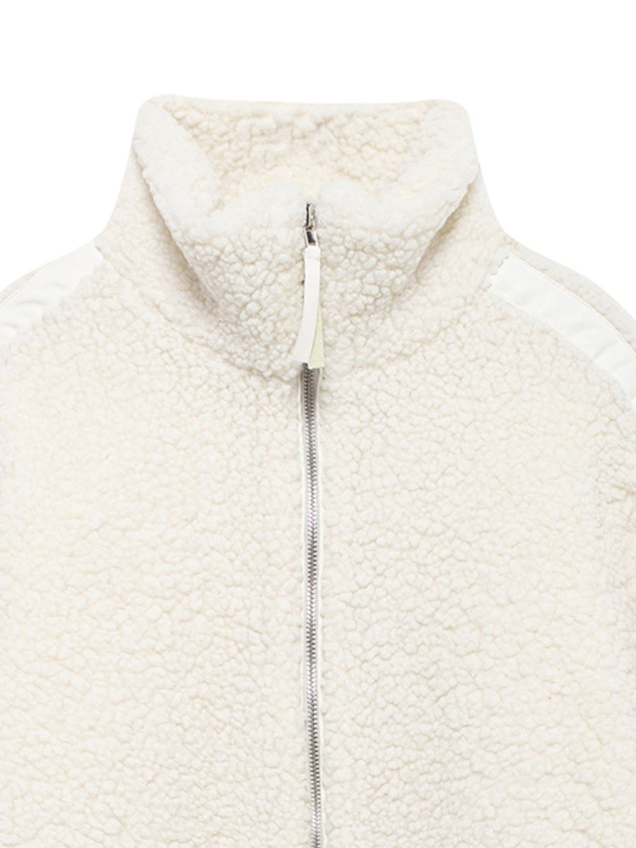White teddy fleece zip-up jacket with contrast piping detail and stand-up collar.