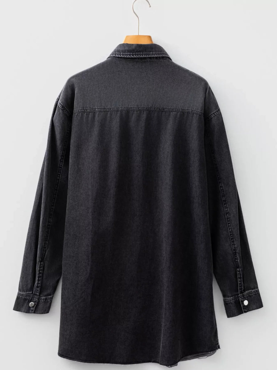 Black denim button-up dress with raw hem and long sleeves.