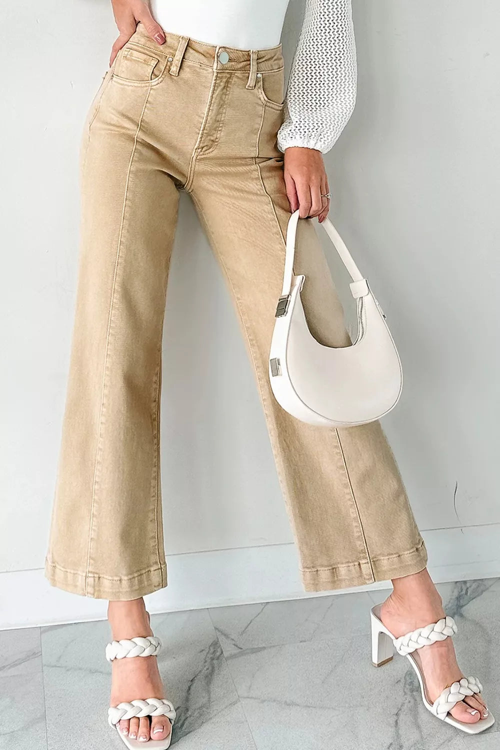 High-waisted cropped wide-leg jeans in tan denim with front seam detail.