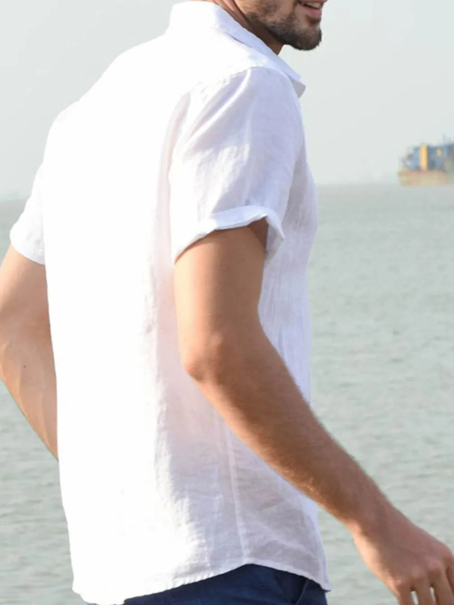 White linen resort shirt with short sleeves and a relaxed fit.
