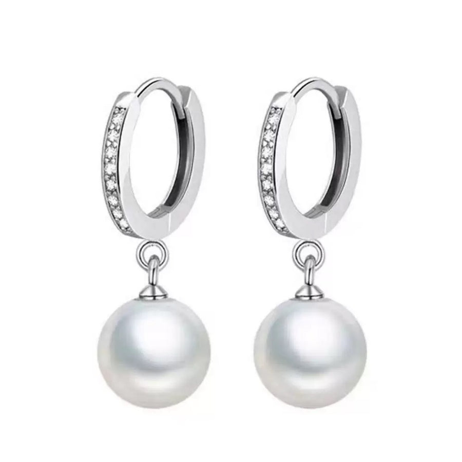 Elegant pearl drop hoop earrings with cubic zirconia accents.
