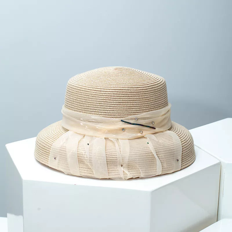Beige wheat straw cloche hat with ribbon and rhinestone detail