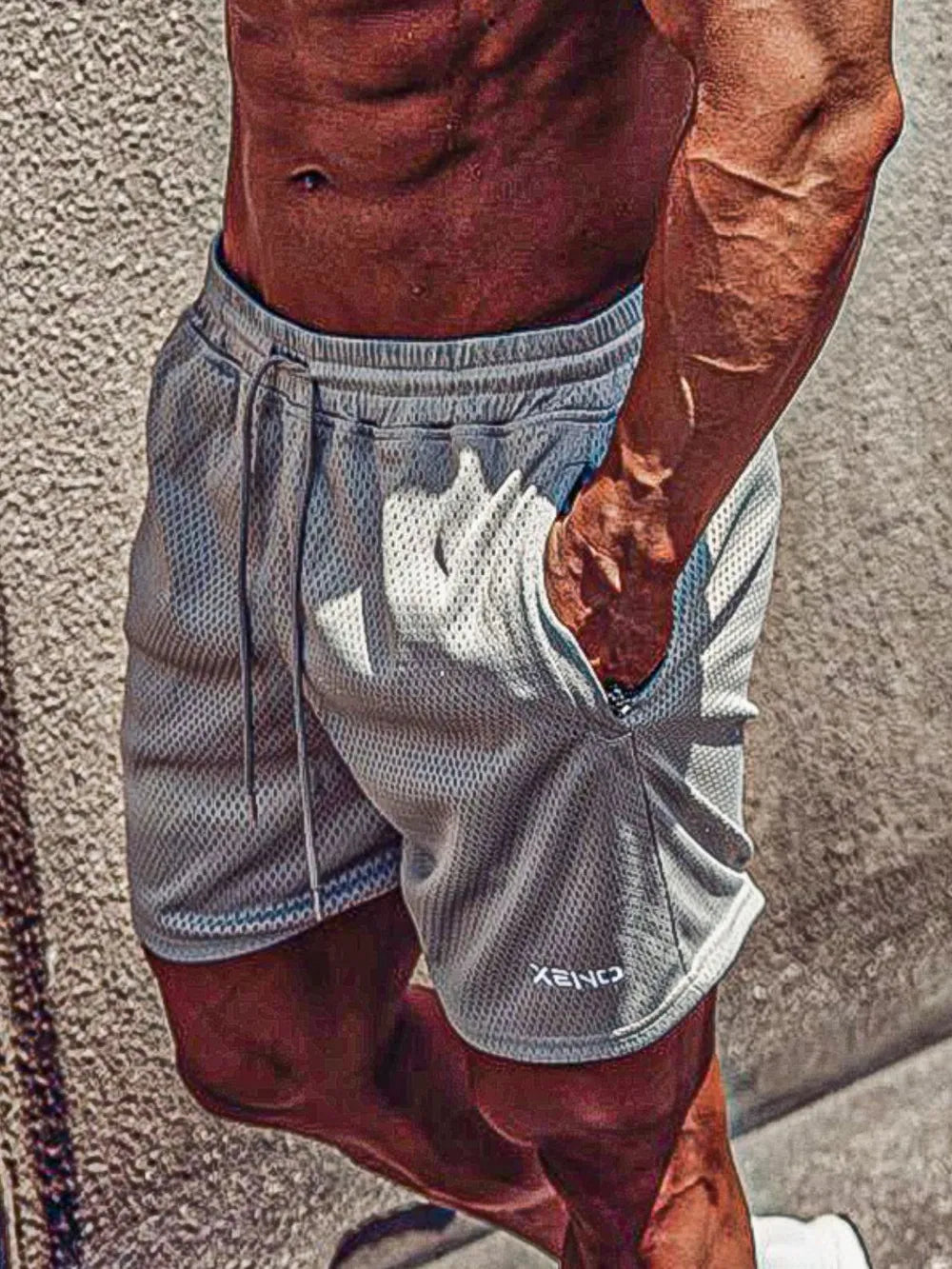 Gray performance mesh drawstring shorts with logo detail