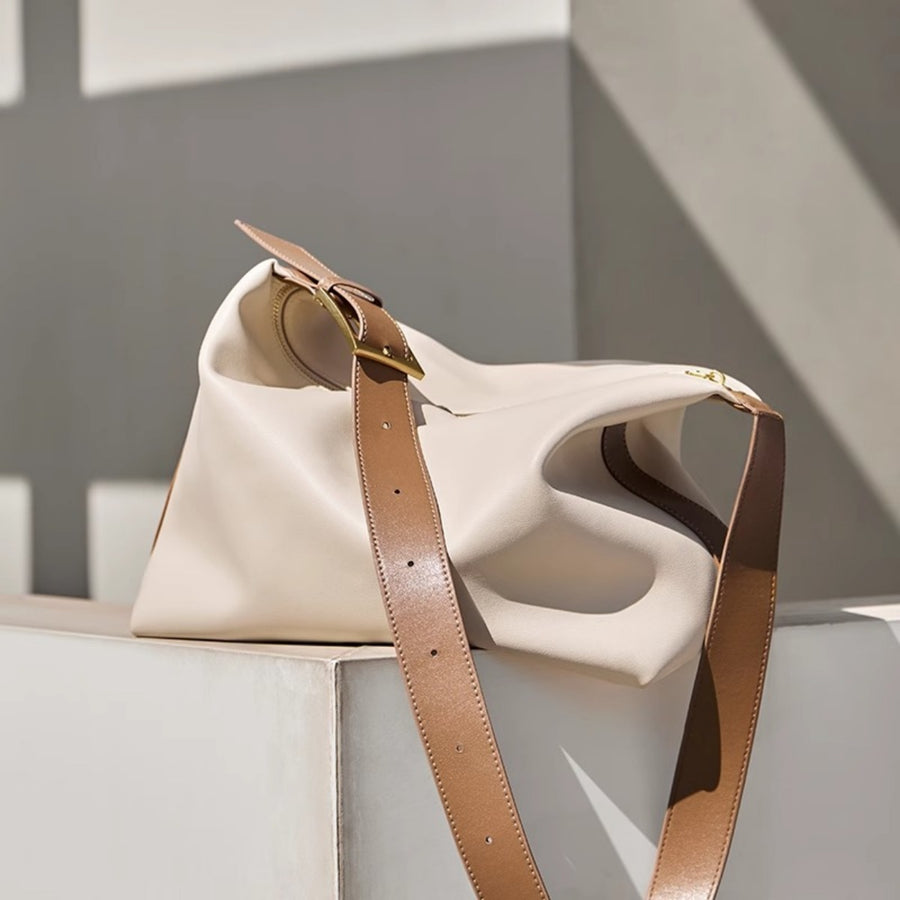 White pu leather shoulder bag with brown strap and gold buckle detail