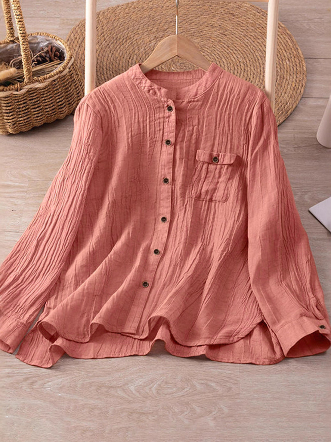 button-down shirt in coral pink featuring chest pocket and relaxed fit