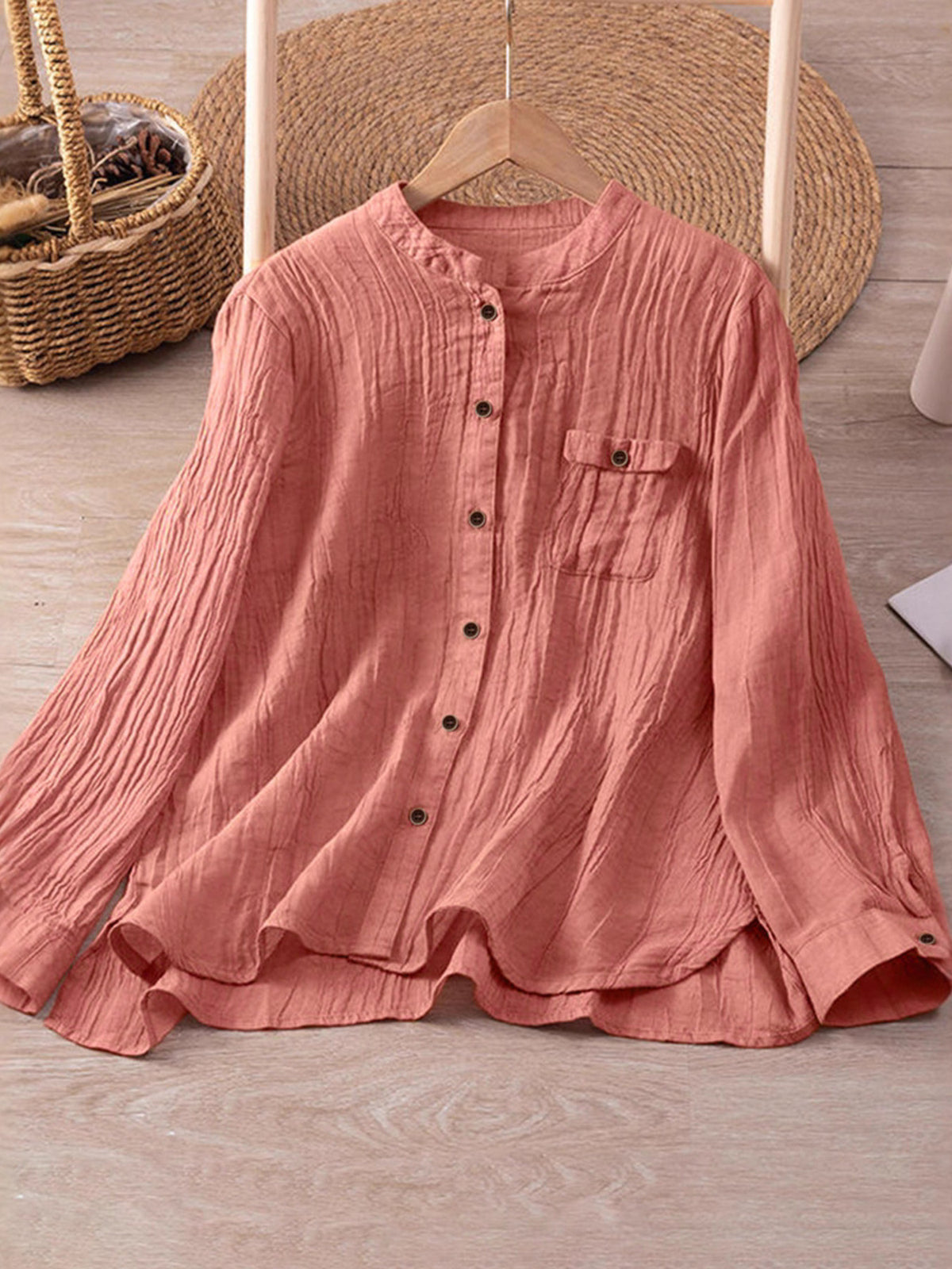 button-down shirt in coral pink featuring chest pocket and relaxed fit