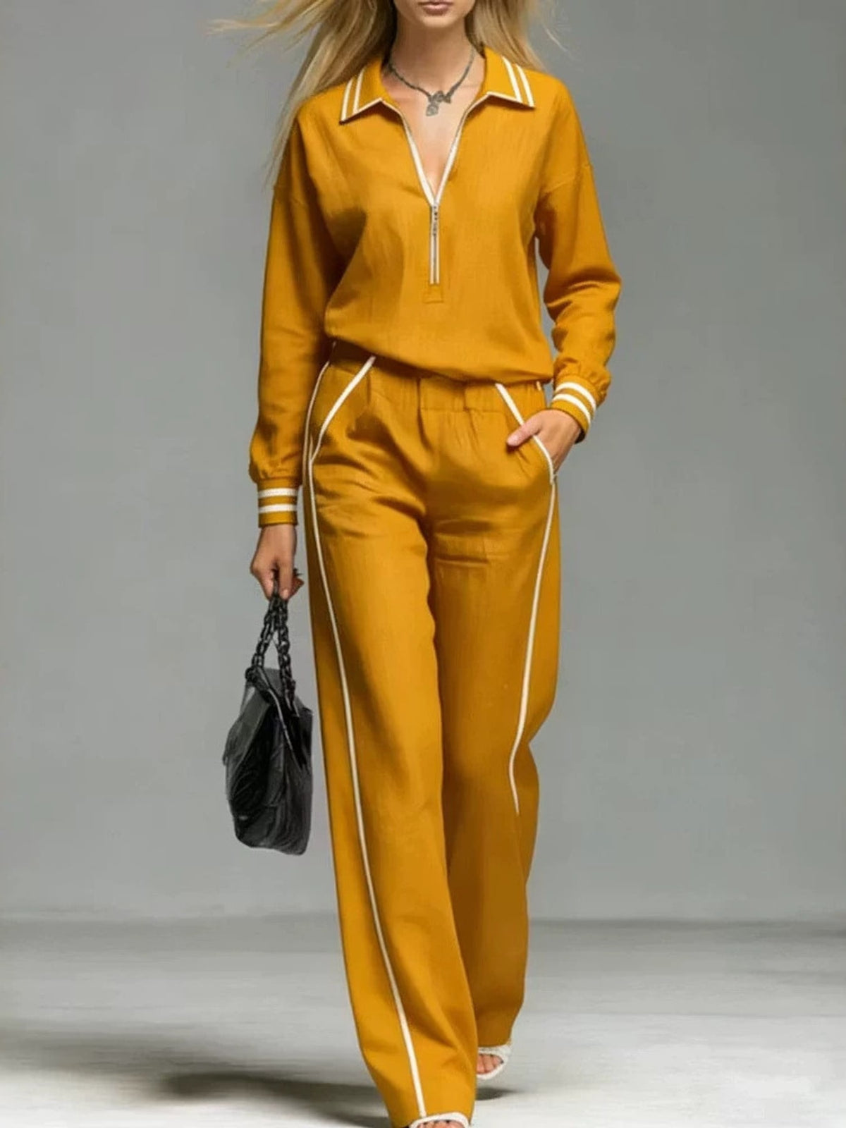 Tangerine sweatshirt and pants set featuring zipper and striped
