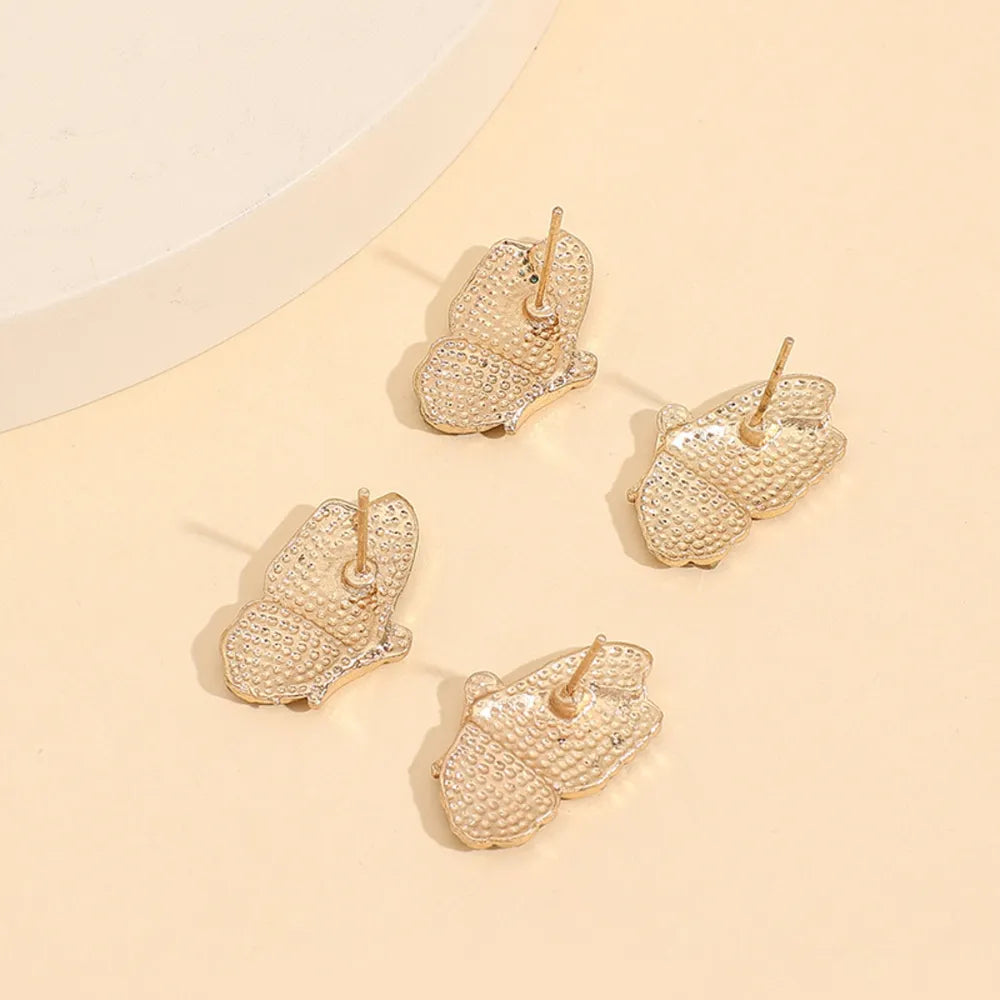 Enamel winged stud earrings with crystals, multicolor alloy butterfly studs with crystal accents