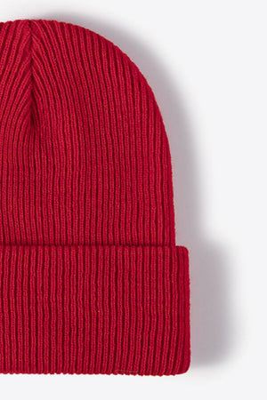 Red ribbed knit beanie with a folded cuff