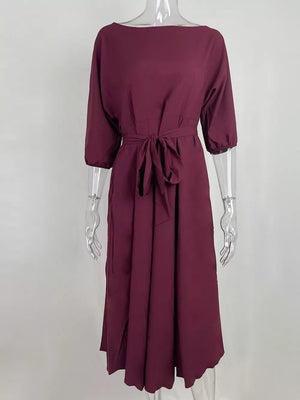 Burgundy off-the-shoulder belted midi dress with 3/4 sleeves and a tie waist.