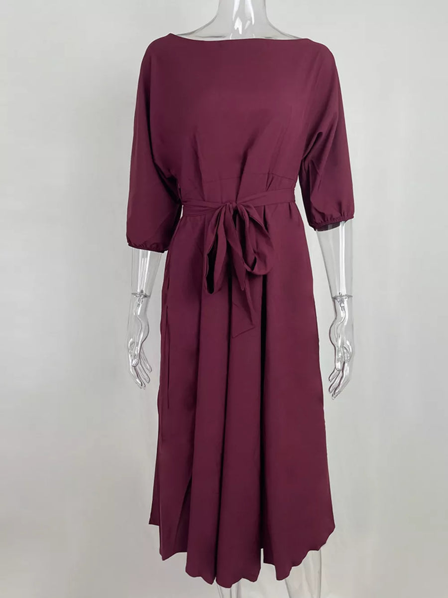 Burgundy off-the-shoulder belted midi dress with 3/4 sleeves and a tie waist.