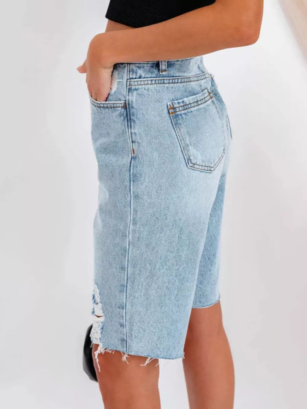50%cotton, 50%spandex Care instructions: Machine wash cold denim shorts in light blue with relaxed silhouette