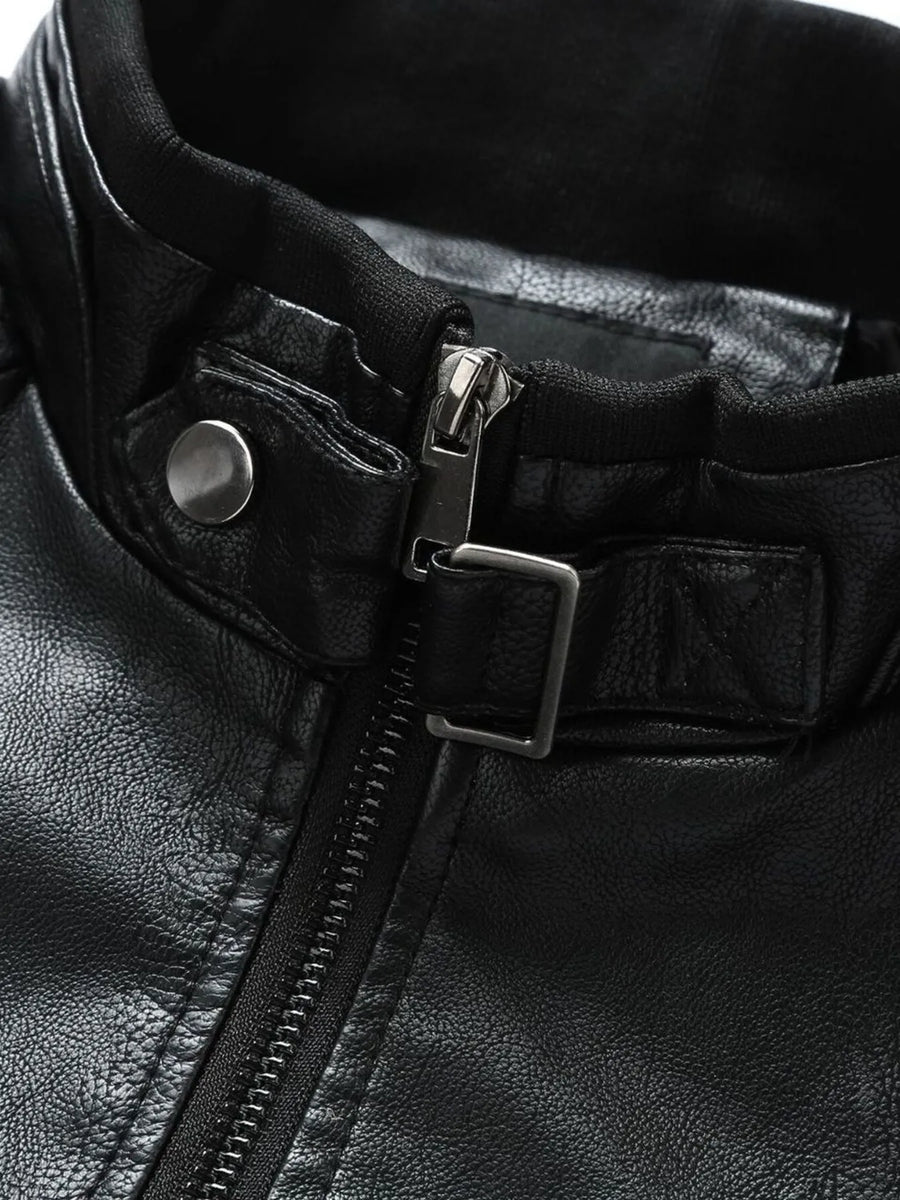 Black plus-size moto jacket with zip-up closure and snap collar detail.