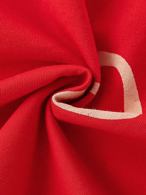Red cotton t-shirt for kids with a cream heart detail and trim.