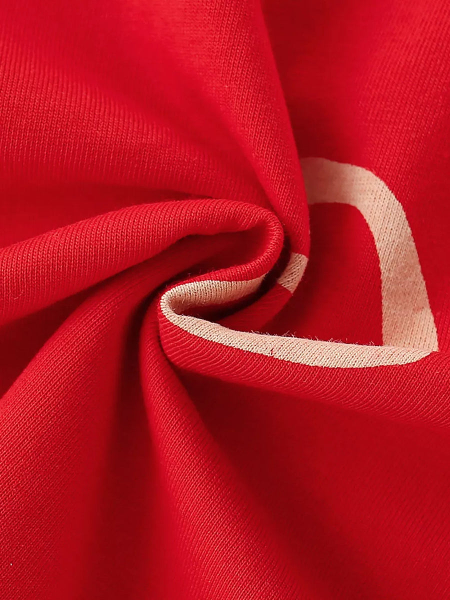 Red cotton t-shirt for kids with a cream heart detail and trim.