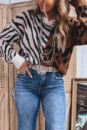 black pullover sweater featuring stretch and animal-print