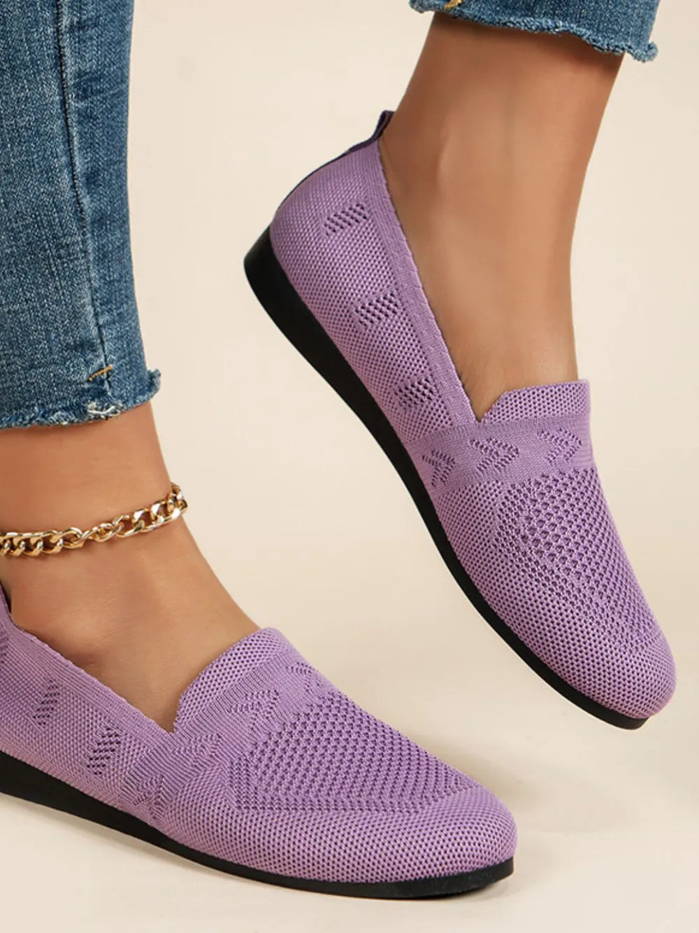 Lilac breathable knit slip-on loafers with a diamond pattern detail.