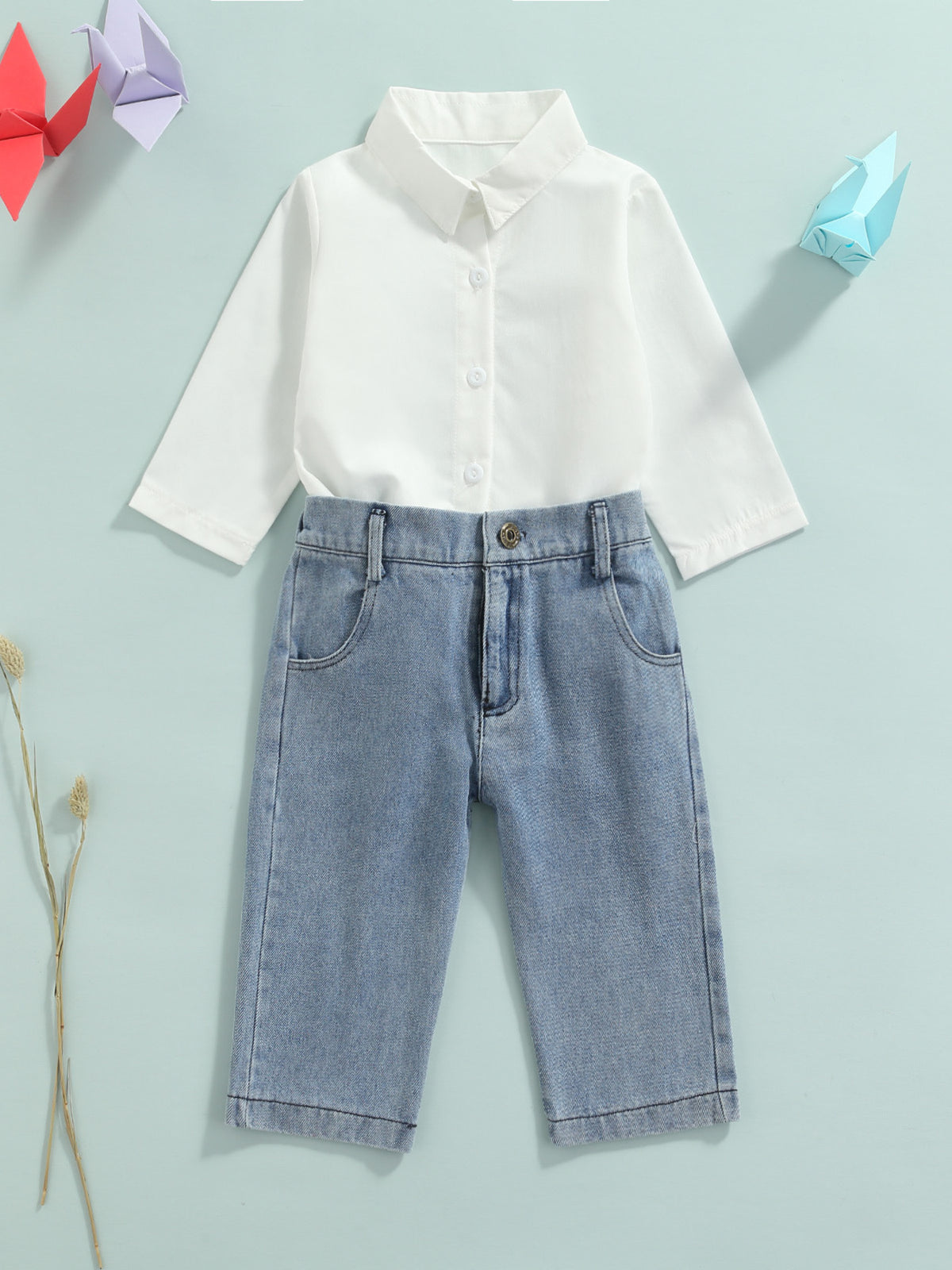 Toddler white cotton button-up shirt and light wash denim jeans set.
