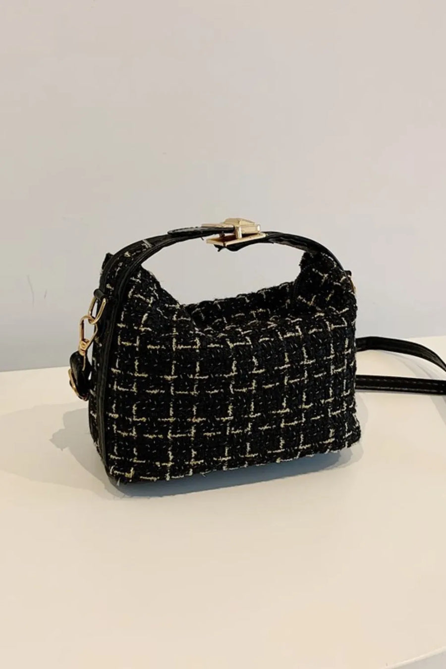 Black tweed box bag with gold clasp and detachable strap