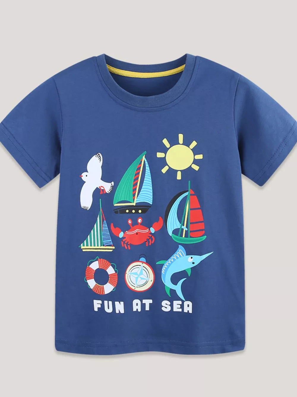 Blue t-shirt with short sleeves and a graphic print of boats, a crab, a seagull, a marlin, a sun, a life preserver, and a