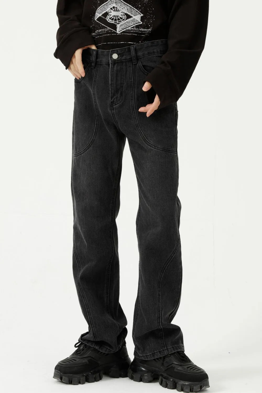 Black denim straight leg jeans with panel seam detailing and a casual fit.