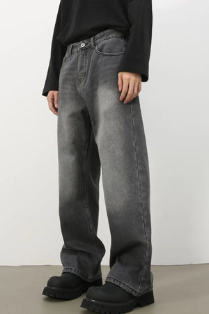 Faded dark gray cotton denim jeans with a wide-leg silhouette.