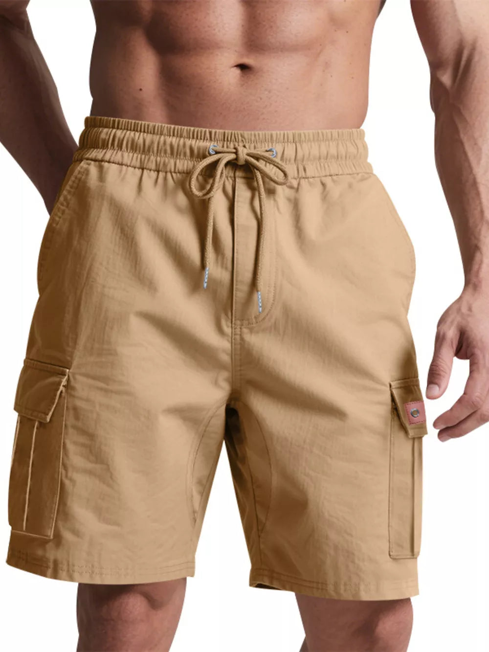 Tan cargo shorts with elastic waistband, drawstring, and flap pockets.