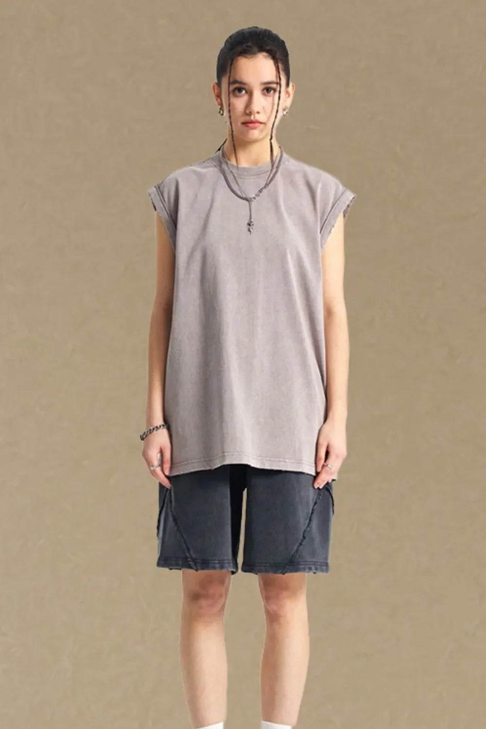 Washed cotton muscle tee in gray, relaxed fit, sleeveless with raw hem.