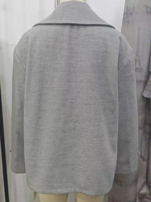 Light gray double-breasted wool blend pea coat with a wide collar.