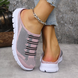 Pink and gray knit slip-on sneakers with striped detail and white soles.