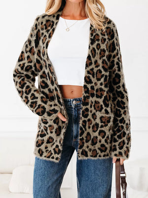 Leopard print fuzzy cardigan with pockets and an open front, worn by a woman.