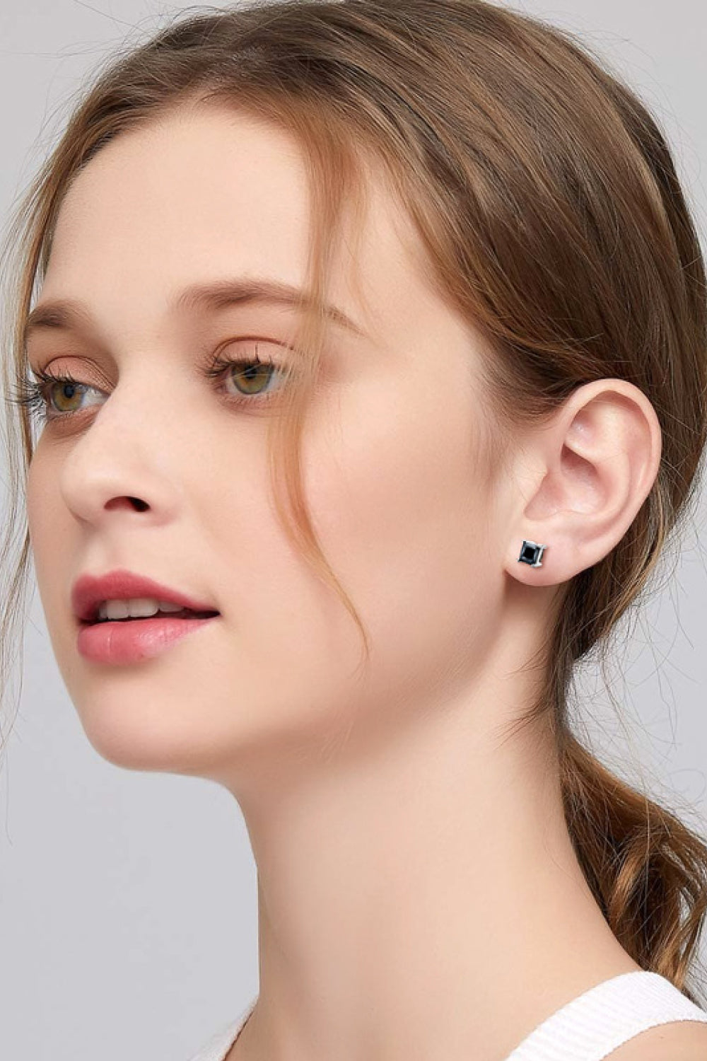 Black square moissanite stud earrings with a modern minimalist design.