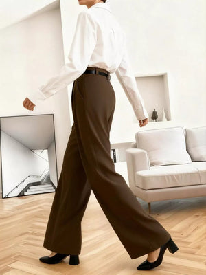 High-waisted brown pleated wide leg maternity trousers with a relaxed fit.