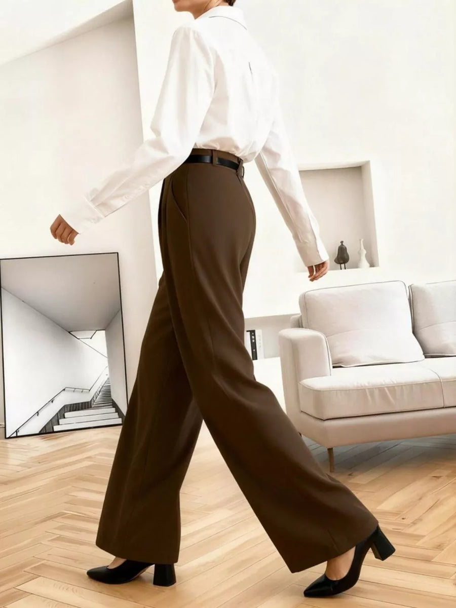 High-waisted brown pleated wide leg maternity trousers with a relaxed fit.