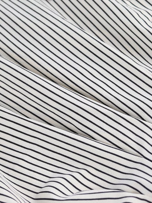Black and white striped maternity shirt with cinched waist detail
