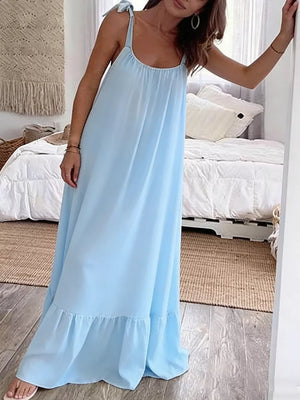 Sky blue maxi dress with tie straps and a ruffled hem, a casual summer style.