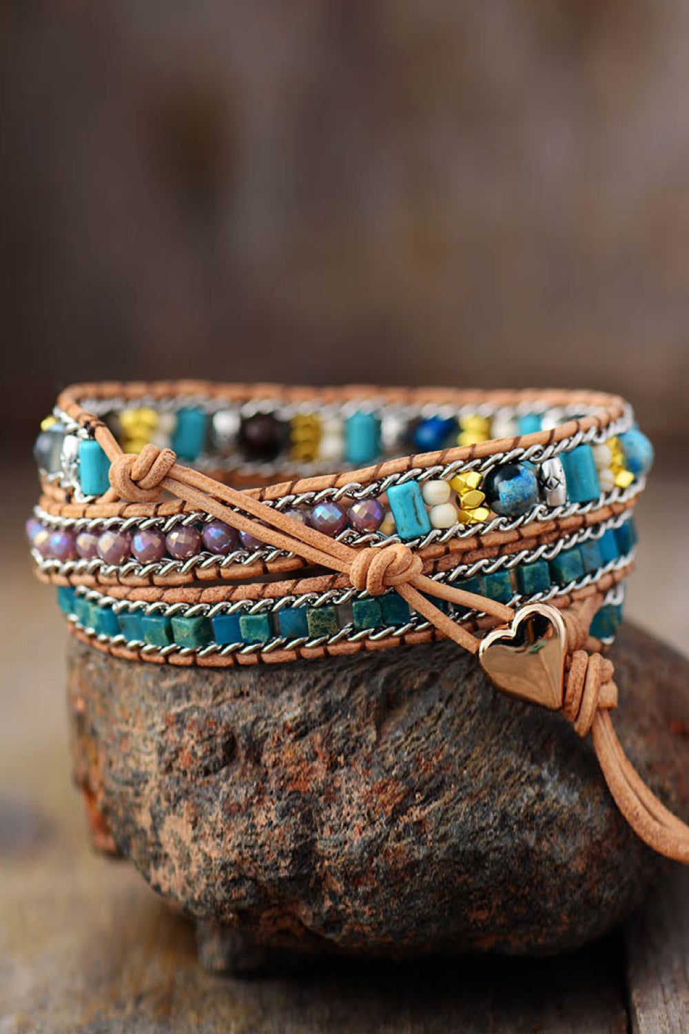 Bohemian wrap bracelet with teal beads, leather, and heart detail.