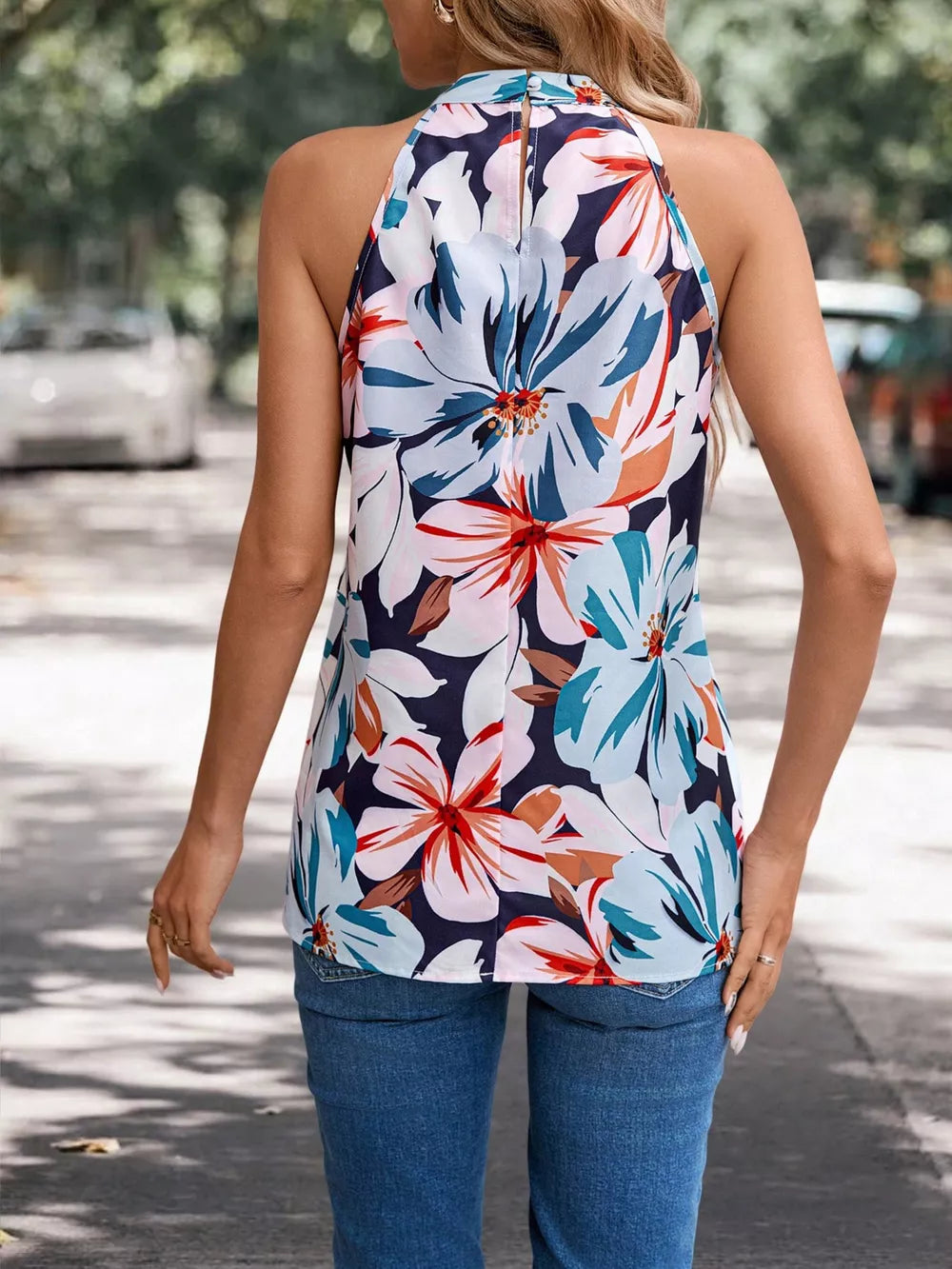 Halter neck floral print tank top with a keyhole back detail.