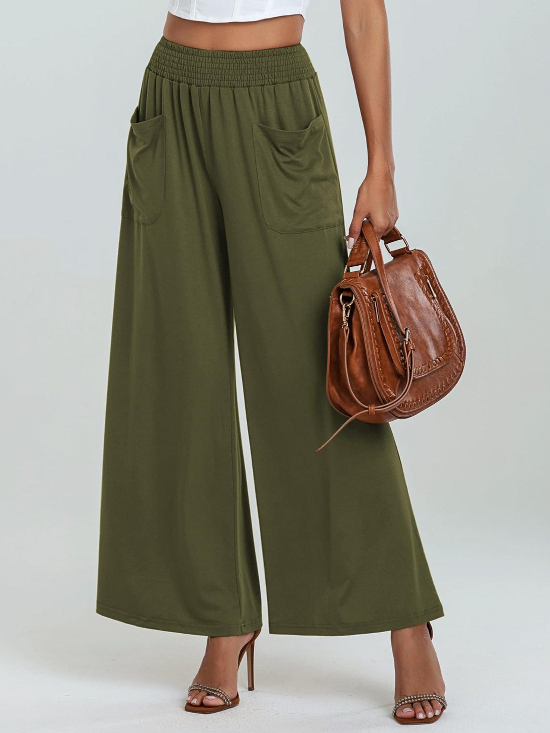 Moss green palazzo trousers with elastic waist and pockets, wide leg.