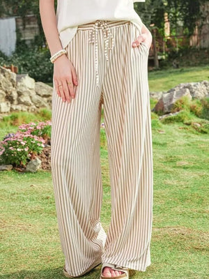 gray wide-leg pants featuring drawstring waist and striped