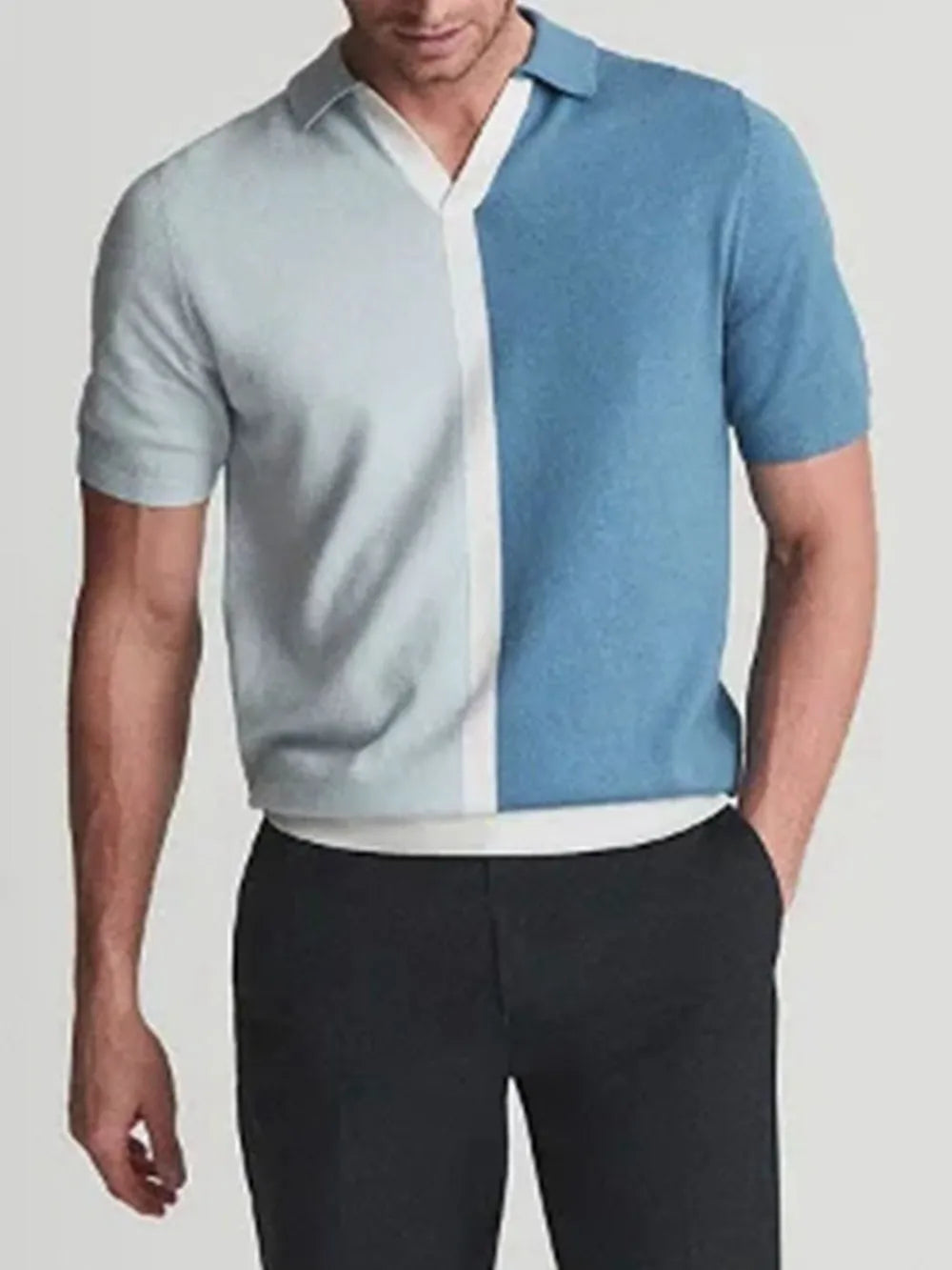 Colorblock knit polo shirt in cerulean with contrast placket and short sleeves.