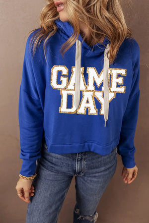 Royal blue cropped hoodie with glitter "GAME DAY" graphic and adjustable drawstring hood.