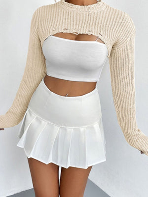 Cream distressed knit bolero crop top with long sleeves and cutouts.