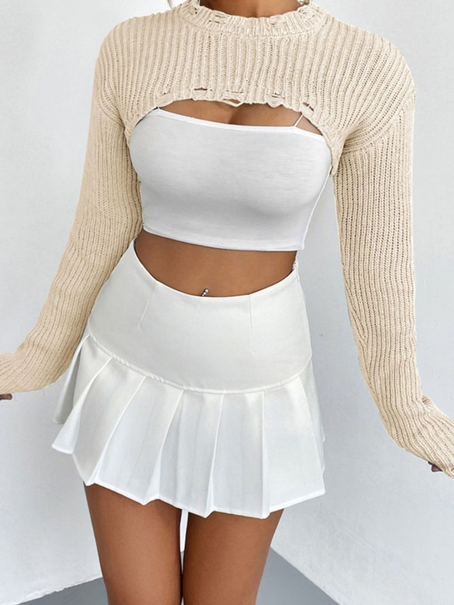 Cream distressed knit bolero crop top with long sleeves and cutouts.