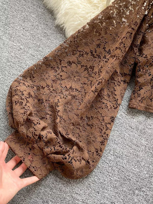 Brown floral lace shirt with balloon sleeves and tie-back detail.