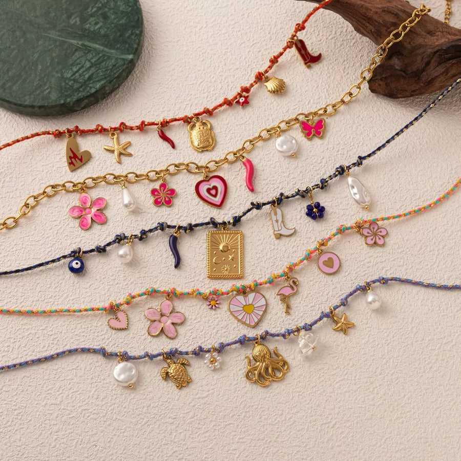 necklace in gold featuring charm details and straight fit